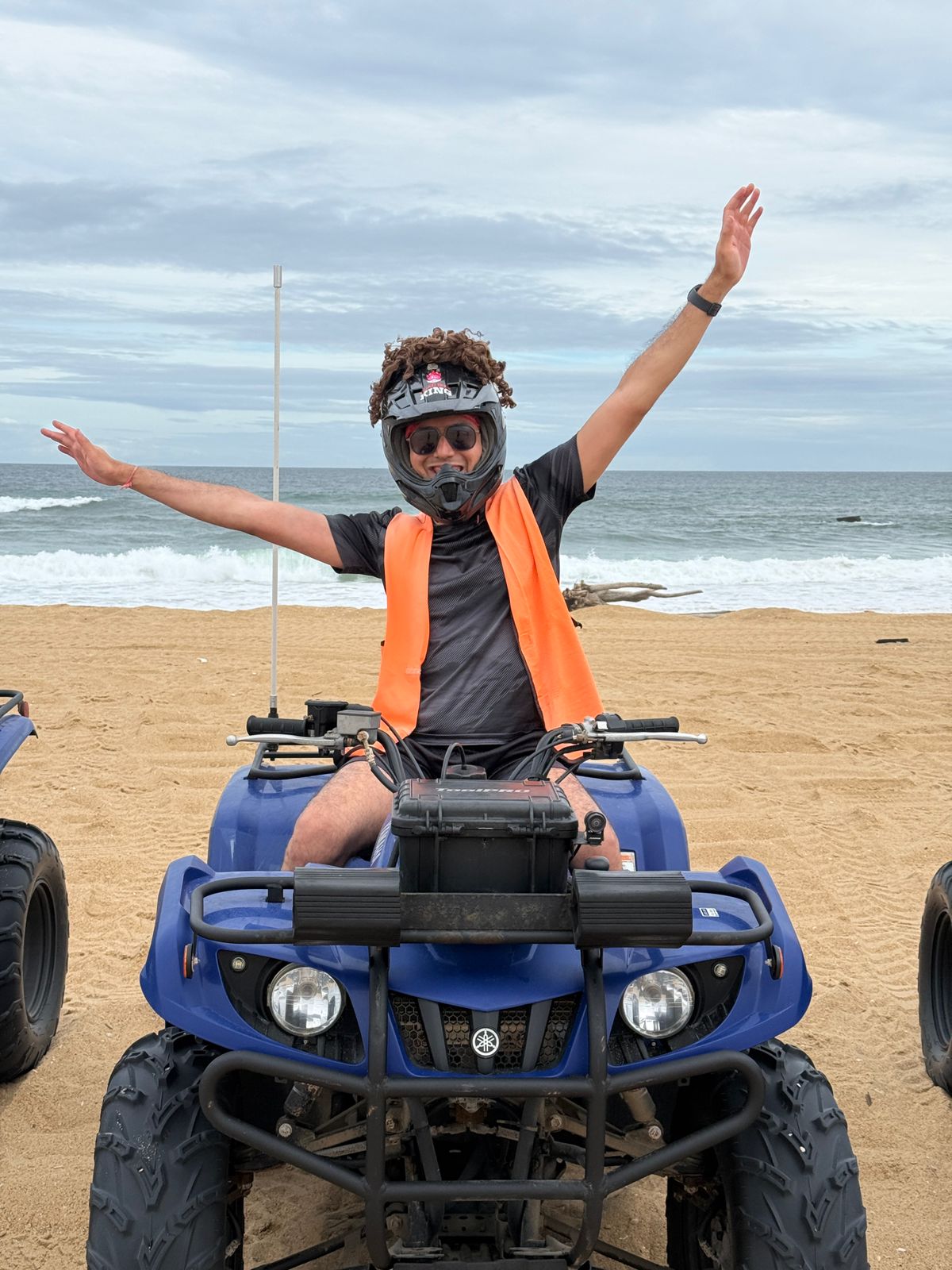 Devashish on a quad bike at the beach